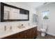 Modern bathroom with dual sinks, sleek countertops, and a large mirror enhancing natural light at 1265 Niagara St, Denver, CO 80220