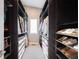 Organized walk-in closet with custom shelving and ample storage space for clothing and accessories at 1265 Niagara St, Denver, CO 80220