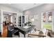 Well-lit home office with a classic desk, comfortable seating, and views of the outside at 1265 Niagara St, Denver, CO 80220