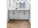 A bathroom with marble countertops, updated fixtures, and modern lighting at 14602 E 2Nd Ave # 204C, Aurora, CO 80011