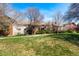 A view of the back of the community with green space and mature landscaping at 14602 E 2Nd Ave # 204C, Aurora, CO 80011