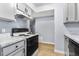 Updated kitchen showcasing sleek grey cabinets, marble countertops, and modern appliances at 14602 E 2Nd Ave # 204C, Aurora, CO 80011