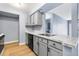 Bright kitchen featuring stainless steel appliances, gray cabinets, and marble countertops at 14602 E 2Nd Ave # 204C, Aurora, CO 80011