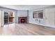 Inviting living room with sliding door to balcony, a decorative fireplace, and natural light at 14602 E 2Nd Ave # 204C, Aurora, CO 80011