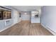 Bright living room featuring modern flooring, large windows, and a pass-through to the kitchen at 14602 E 2Nd Ave # 204C, Aurora, CO 80011