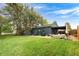 The backyard boasts a well-maintained lawn, patio and shed at 1411 S Beach Ct, Denver, CO 80219
