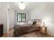Serene bedroom with hardwood floors, natural light, and closet at 1411 S Beach Ct, Denver, CO 80219