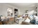 Inviting living room with hardwood floors, stylish decor, and an open layout at 1411 S Beach Ct, Denver, CO 80219