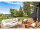 Back patio features brick, a shed, and yard at 1411 S Beach Ct, Denver, CO 80219