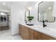 Bathroom featuring a double sink vanity with modern fixtures and access to the shower at 475 S Race St, Denver, CO 80209