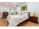 Comfortable bedroom with hardwood floors, modern decor, and plenty of natural light at 475 S Race St, Denver, CO 80209