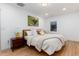 Bedroom features hardwood floors, artwork, natural light, and stylish decor at 475 S Race St, Denver, CO 80209