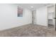 Carpeted bedroom with a single window and adjacent bathroom and closet entrances at 475 S Race St, Denver, CO 80209