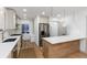 Spacious kitchen features stainless steel appliances, white cabinets and a kitchen island at 475 S Race St, Denver, CO 80209