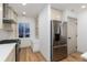 Modern kitchen with stainless steel appliances, gas range, and bright window seat at 475 S Race St, Denver, CO 80209