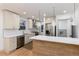 Beautiful kitchen features stainless steel appliances, white cabinets and a kitchen island at 475 S Race St, Denver, CO 80209