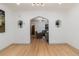 Bright living room featuring hardwood floors, recessed lighting, and arched doorways at 475 S Race St, Denver, CO 80209