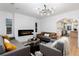 Stylish living room featuring modern decor, a sleek fireplace, and an open layout connecting to the kitchen at 475 S Race St, Denver, CO 80209