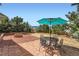 Inviting brick patio with fire pit and outdoor dining set, perfect for entertaining and relaxation at 17456 Quarry Way, Monument, CO 80132