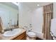 Bathroom with a single sink vanity, a shower and tub combination, and a mirrored medicine cabinet at 17456 Quarry Way, Monument, CO 80132