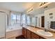 Bathroom with double sink vanity, large soaking tub, glass enclosed shower and large mirror at 17456 Quarry Way, Monument, CO 80132