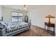 Bedroom with a comfortable bed, a window with blinds, and plenty of natural light at 17456 Quarry Way, Monument, CO 80132