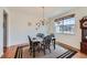 Cozy dining room with chandelier, natural light and seating for four at 17456 Quarry Way, Monument, CO 80132