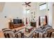 Bright, open living room with high ceilings, fireplace and an abundance of natural light at 17456 Quarry Way, Monument, CO 80132