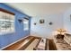 Comfortable living room with lots of natural light, hardwood floors and neutral walls at 17456 Quarry Way, Monument, CO 80132
