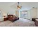 Spacious main bedroom with a ceiling fan, window, and ample room for a large bed and furnishings at 17456 Quarry Way, Monument, CO 80132