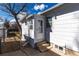 Back of house with small yard, patio and chain link fence at 2819 S Bannock St, Englewood, CO 80110