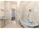 Bathroom with clawfoot tub, period-style sink, and decorative tile flooring at 2819 S Bannock St, Englewood, CO 80110