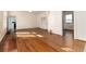 Inviting living room featuring wood floors, natural light, and seamless flow into adjacent spaces at 2819 S Bannock St, Englewood, CO 80110