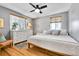 Bright bedroom with hardwood floors, large windows, ceiling fan, and neutral decor at 85 N Ogden St # 13, Denver, CO 80218