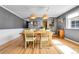 This dining space features hardwood floors, warm lighting, and a seamless transition to the adjacent kitchen at 85 N Ogden St # 13, Denver, CO 80218