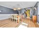 Dining area showcases stylish lighting, hardwood floors, neutral color palette, and an archway to the kitchen at 85 N Ogden St # 13, Denver, CO 80218