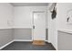 Entryway showing unit #3 with neutral walls and trim, and a decorative wreath at 85 N Ogden St # 13, Denver, CO 80218