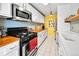 Well-lit kitchen with butcher block countertops, stainless steel appliances, white cabinets, and subway tile backsplash at 85 N Ogden St # 13, Denver, CO 80218