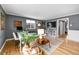 The spacious living room features large windows, hardwood floors, and contemporary furnishings at 85 N Ogden St # 13, Denver, CO 80218
