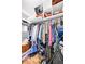 Spacious walk-in closet with built-in shelving and hanging rods providing ample storage space at 85 N Ogden St # 13, Denver, CO 80218
