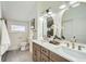 Elegant bathroom with double vanity, large mirrors, and modern fixtures at 2133 S Parfet Dr, Lakewood, CO 80227