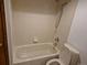 Clean, tiled bathroom with a shower-tub combination and neutral finishes for a functional space at 2477 S Oakland Cir, Aurora, CO 80014