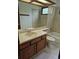 Traditional bathroom with a tiled shower-tub, toilet, and vanity with a sink, offering a functional space at 2477 S Oakland Cir, Aurora, CO 80014