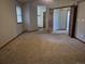 This bedroom features neutral paint and multiple entrances and views into other rooms at 2477 S Oakland Cir, Aurora, CO 80014