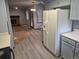 View from the kitchen with modern appliances and a view into the living room at 2477 S Oakland Cir, Aurora, CO 80014