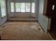 Bright living room with bay windows and a built-in window seat, ready for customization at 2477 S Oakland Cir, Aurora, CO 80014
