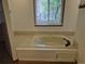 This bathroom features a standalone tub with chrome hardware at 2477 S Oakland Cir, Aurora, CO 80014