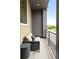 Relax on this cozy balcony with comfortable seating and neighborhood views at 928 Cimarron Dr # C, Lafayette, CO 80026