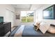 Tranquil bedroom features a large window, closet, and comfortable bed with stylish decor at 928 Cimarron Dr # C, Lafayette, CO 80026