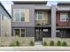 Contemporary home featuring a modern facade, private balconies, and low-maintenance landscaping at 928 Cimarron Dr # C, Lafayette, CO 80026